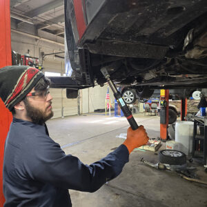 HTC Automotive repair bay with vehicles being serviced